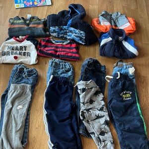 18-24 and some 2T toddler boy clothes/infant boy clothes